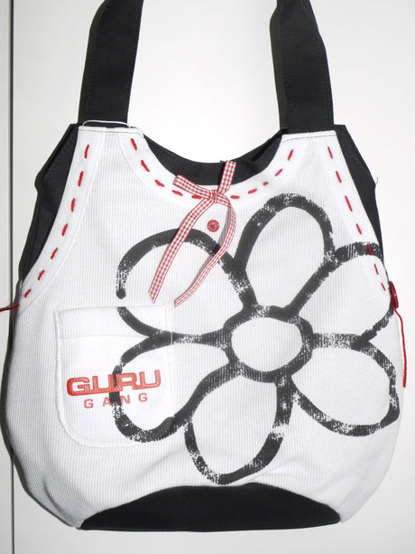White mesh tote bag with bold black flower stitching, red accents, and Guru Gang logo – playful streetwear accessory