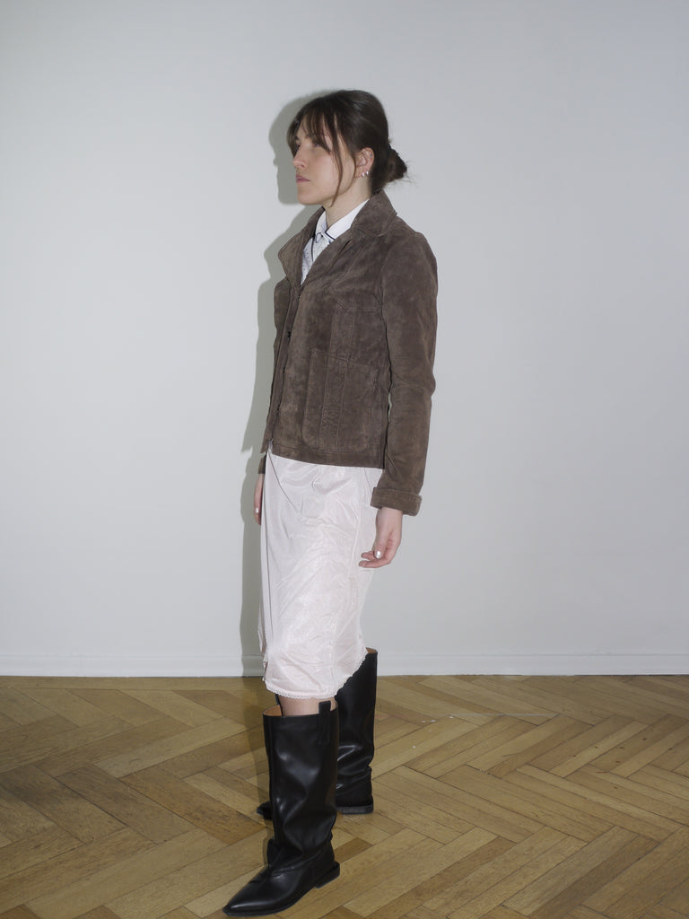 Side view of Miu Miu inspired outfit featuring a fuzzy brown zip-up jacket and flowing white dress – soft grunge meets elegant minimalism.