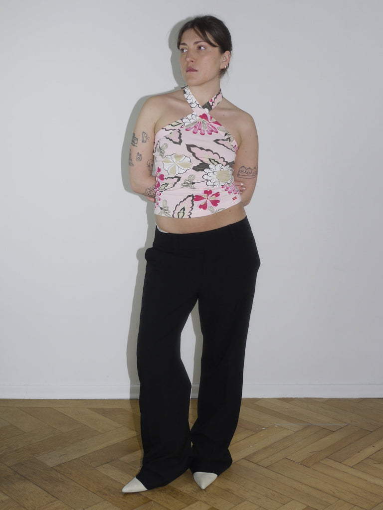 Pink floral halter top with open back and ruched sides – Y2K-inspired, reminiscent of early 2000s Diesel and Blumarine aesthetics.