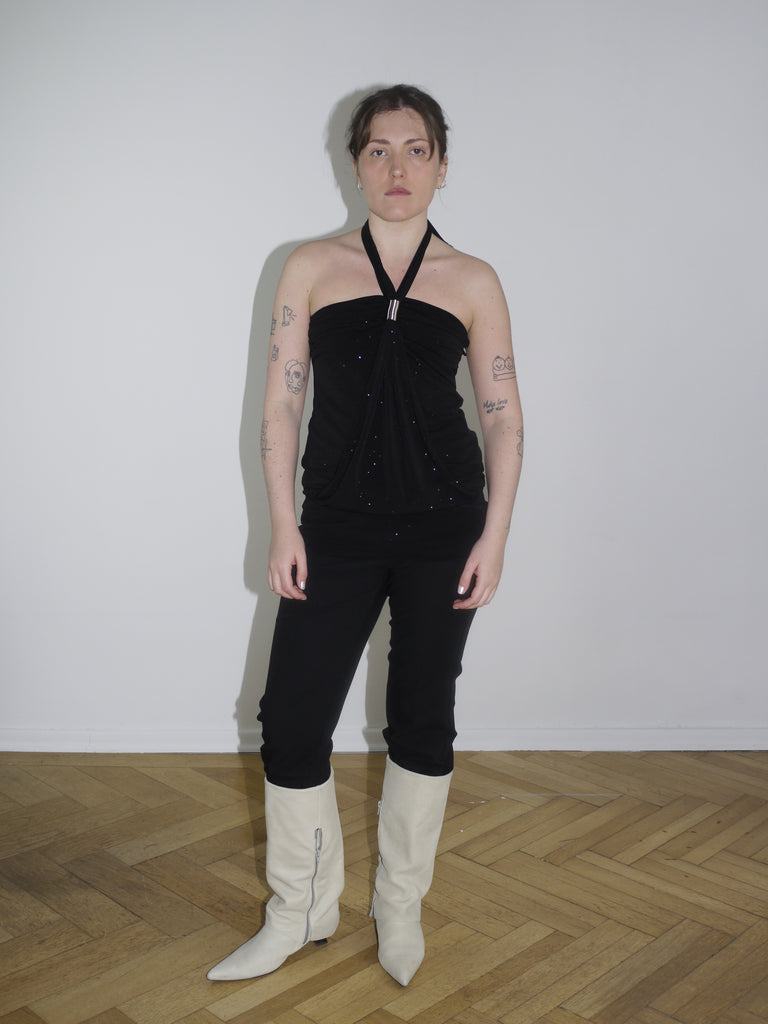 Front view of halter crop top and sleek black trousers – Dsquared² energy with 2000s minimal clubwear vibe