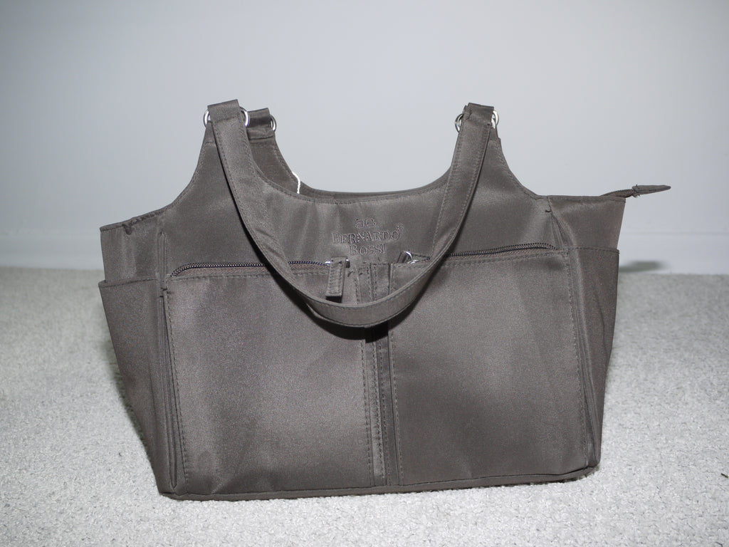 Vintage Bernardo Bossi tote bag in deep taupe nylon with double top handles, zippered front pocket, and silver hardware. Structured silhouette with practical compartments.