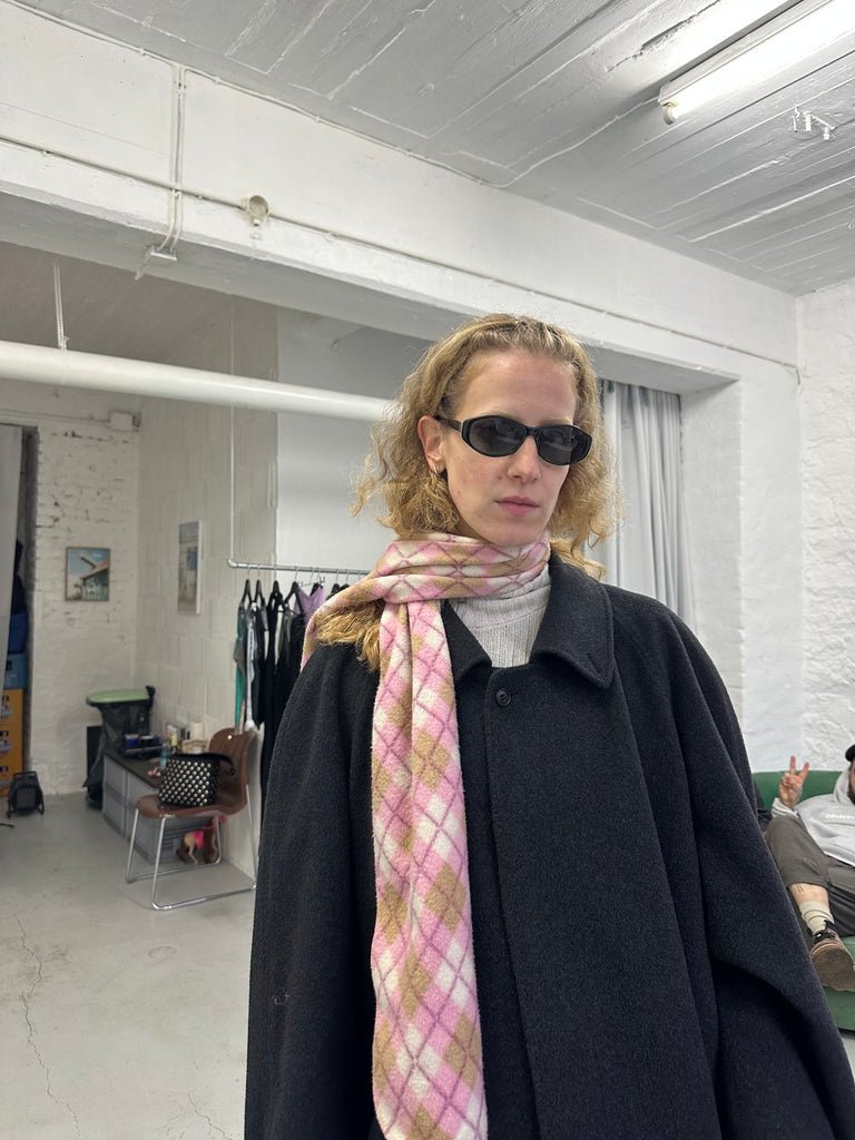 Vintage black Fendi sunglasses with slim oval frame, 90s Y2K designer eyewear style, minimalist retro aesthetic, unisex fashion accessory on white background.